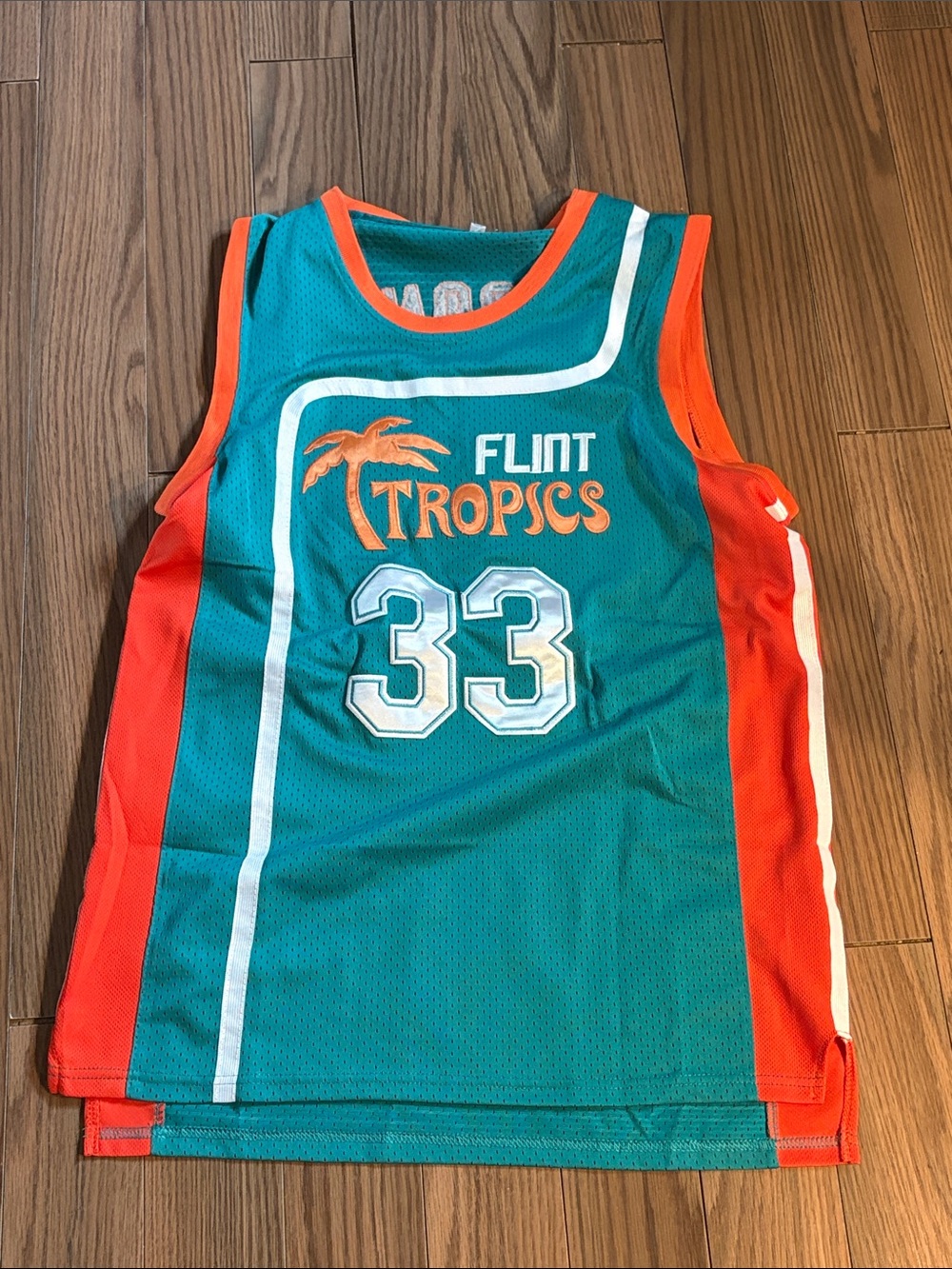 Flint Tropics Teal & Orange Basketball Jersey #33 Jackie Moon